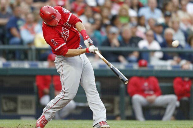 Los Angeles Angles' Mike Trout hits a home run on a pitch from Seattle Mariners' Mike Montgomery during a baseball game on Friday, July 10, 2015, in Seattle. (AP Photo/John Froschauer)