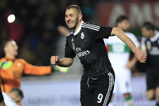 Real Madrid's Karim Benzema, from France, celebrates after scoring against Elche during a Spanish La Liga soccer match at the Manuel Martinez Valero stadium in Elche, Spain, on Sunday, Feb. 22, 2015. (AP Photo/Alberto Saiz)