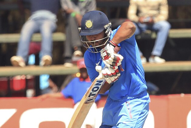 Indian batsman Kedar Jadhav blocks  the ball on the third day of the One Day International  cricket match against Zimbabwe in  Harare, Zimbabwe, Tuesday, July,14, 2015.   (AP Photo/Tsvangirayi Mukwazhi)