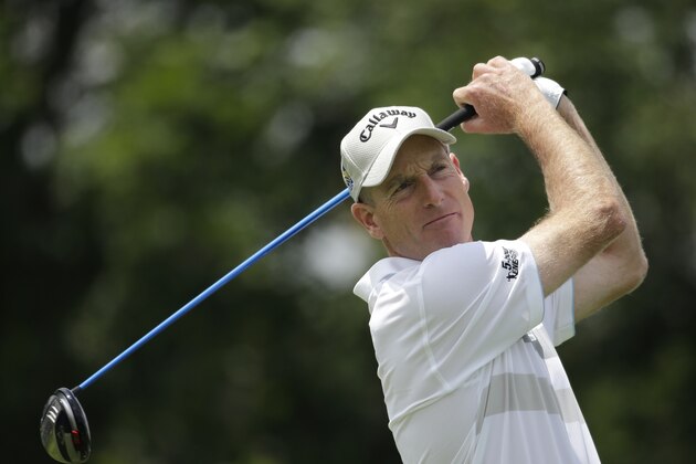 Jim Furyk tees off on the first hole during the third round of the Memorial golf tournament Saturday, June 6, 2015, in Dublin, Ohio. (AP Photo/Darron Cummings)