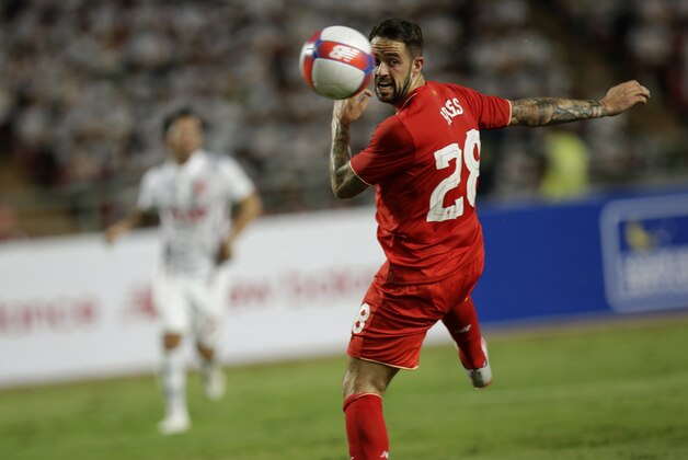 Liverpool's Danny Ings jumps for the ball during their friendly soccer match against Thailand All Stars, at Rajamangala national stadium in Bangkok, Thailand, Tuesday, July 14, 2015. Liverpool's beat Thailand All Star 4-0. (AP Photo/Sakchai Lalit)