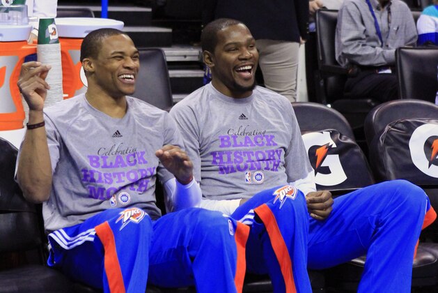 Oklahoma City Thunder guard Russell Westbrook, left, and forward Kevin Durant, right, share a laugh before the start of an NBA basketball game against the New Orleans Pelicans in Oklahoma City, Friday, Feb. 6, 2015.  (AP Photo/Alonzo Adams)