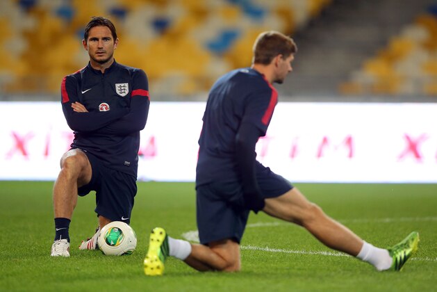 KIEV, UKRAINE - SEPTEMBER 09:  Frank Lampard and Steven Gerrard of England look on during a training session at the Olympic Stadium on September 9, 2013 in Kiev, Ukraine.  (Photo by Clive Rose/Getty Images)
