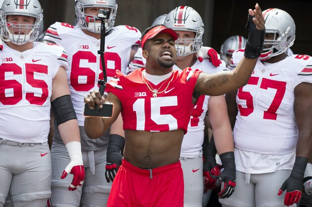 Apr 18, 2015; Columbus, OH, USA; Ohio State Scarlet Team running back Ezekiel Elliott (15) fires up the fans before the team enters the field for the Ohio Spring Game at Ohio Stadium. Mandatory Credit: Greg Bartram-USA TODAY Sports