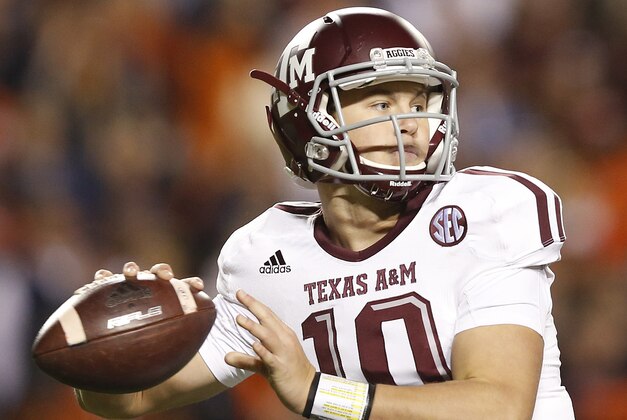 Texas A&M quarterback Kyle Allen (10) sets back to throw the ball against Auburn during the second half of an NCAA college football game Saturday, Nov. 8, 2014, in Auburn, Ala. Texas A&M defeated Auburn 41-38. (AP Photo/Brynn Anderson)