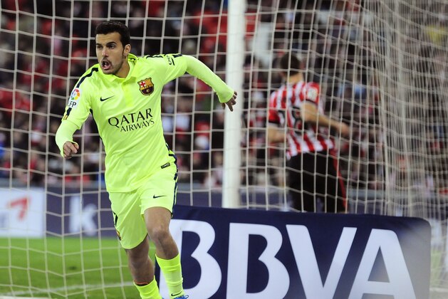 FC Barcelona's Pedro Rodriguez celebrates his goal and the fifth of his team after scoring against Athletic Bilbao during their La Liga soccer match, at San Mames stadium in Bilbao, northern Spain, Sunday, Feb. 8, 2015.  FC Barcelona won the match 5-2.(AP Photo/Alvaro Barrientos)