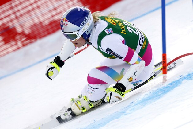 Lindsey Vonn speeds down the course during an alpine ski, women's World Cup super-G, in Cortina d'Ampezzo, Italy, Monday, Jan. 19, 2015. (AP Photo/Alessandro Trovati)