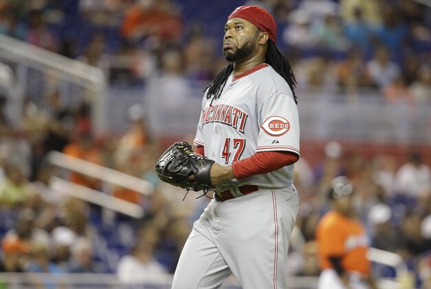 Cincinnati Reds starting pitcher Johnny Cueto walks to the dugout after pitching in the fourth inning of a baseball game against the Miami Marlins, Sunday, July 12, 2015, in Miami.  (AP Photo/Lynne Sladky)