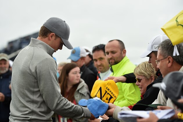 ST ANDREWS, SCOTLAND - JULY 14:  Jordan Spieth of the United States signs autographs ahead of the 144th Open Championship at The Old Course on July 14, 2015 in St Andrews, Scotland.  (Photo by Stuart Franklin/Getty Images)
