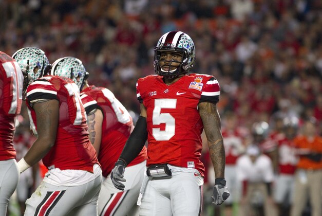 Jan 3, 2014; Miami Gardens, FL, USA; Ohio State Buckeyes quarterback Braxton Miller (5) looks to the sidelines during the first half in the 2014 Orange Bowl college football game against the Clemson Tigers at Sun Life Stadium. Mandatory Credit: Joshua S. Kelly-USA TODAY Sports