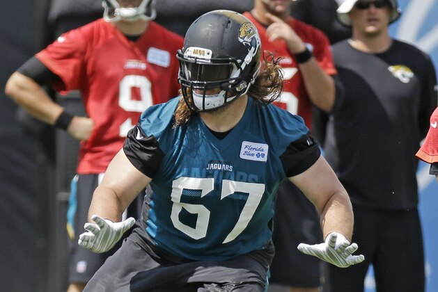 Jacksonville Jaguars tackle Austin Pasztor (67) runs through a scrimmage during NFL football organized training activities, Tuesday, June 9, 2015, in Jacksonville, Fla. (AP Photo/John Raoux)