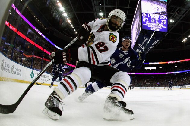 TAMPA, FL - JUNE 13: Ondrej Palat #18 of the Tampa Bay Lightning and Johnny Oduya #27 of the Chicago Blackhawks battle for the puck during the first period of Game Five of the 2015 NHL Stanley Cup Final at Amalie Arena on June 13, 2015 in Tampa, Florida. (Photo by Dave Sandford/NHLI via Getty Images) TAMPA, FL - JUNE 13: Ondrej Palat #18 of the Tampa Bay Lightning and Johnny Oduya #27 of the Chicago Blackhawks battle for the puck during the first period of Game Five of the 2015 NHL Stanley Cup Final at Amalie Arena on June 13, 2015 in Tampa, Florida. (Photo by Dave Sandford/NHLI via Getty Images)
