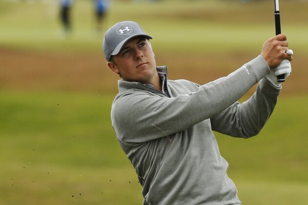 United States’ Jordan Spieth plays a shot from the rough on hole 15 during a practice round at the British Open Golf Championship at the Old Course, St. Andrews, Scotland, Tuesday, July 14, 2015. (AP Photo/Jon Super)
