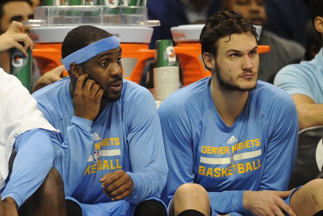Feb 22, 2015; Oklahoma City, OK, USA;  Denver Nuggets guard Ty Lawson (3) and Denver Nuggets forward Danilo Gallinari (8) watch their team from the bench during action against the Oklahoma City Thunder at Chesapeake Energy Arena. Mandatory Credit: Mark D. Smith-USA TODAY Sports