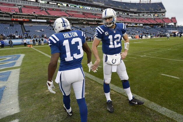 Indianapolis Colts quarterback Andrew Luck (12) greets wide receiver T.Y. Hilton (13) before an NFL football game against the Tennessee Titans Sunday, Dec. 28, 2014, in Nashville, Tenn. (AP Photo/Mark Zaleski)