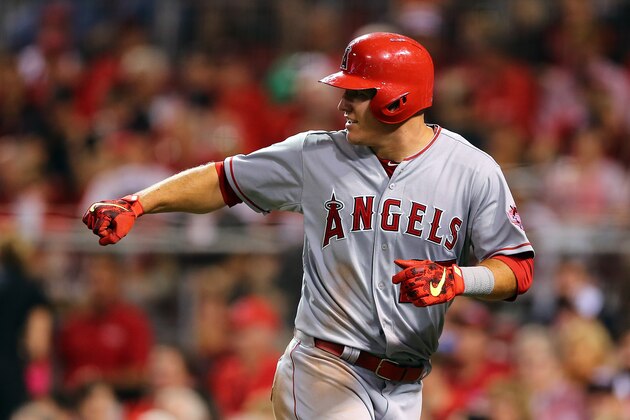 CINCINNATI, OH - JULY 14:  American League All-Star Mike Trout #27 of the Los Angeles Angels of Anaheim celebrates after scoing off of American League All-Star Prince Fielder #84 of the Texas Rangers single to left field against National League All-Star Clayton Kershaw #22 of the Los Angeles Dodgers during the 86th MLB All-Star Game at the Great American Ball Park on July 14, 2015 in Cincinnati, Ohio.  (Photo by Elsa/Getty Images)