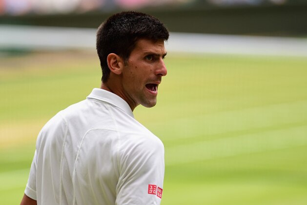 LONDON, ENGLAND - JULY 12:  Novak Djokovic of Serbia reacts in the Final Of The Gentlemen's Singles against Roger Federer of Switzerland on day thirteen of the Wimbledon Lawn Tennis Championships at the All England Lawn Tennis and Croquet Club on July 12, 2015 in London, England.  (Photo by Shaun Botterill/Getty Images)