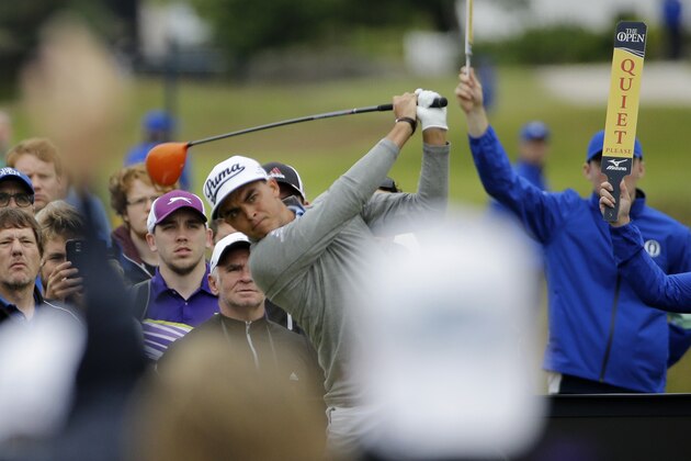 United States’ Rickie Fowler follows a drive from the 14th tee during a practice round at the British Open Golf Championship at the Old Course, St. Andrews, Scotland, Tuesday, July 14, 2015. (AP Photo/David J. Phillip)
