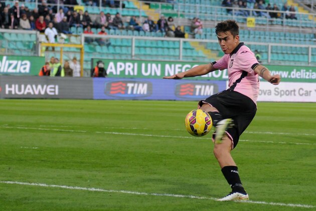 Palermo's Paulo Dybala scores his side fourth goal during the Serie A soccer match between Palermo and Cagliari, in Palermo, Italy,Tuesday Jan. 6,  2015. (AP Photo/Alessandro Fucarini)