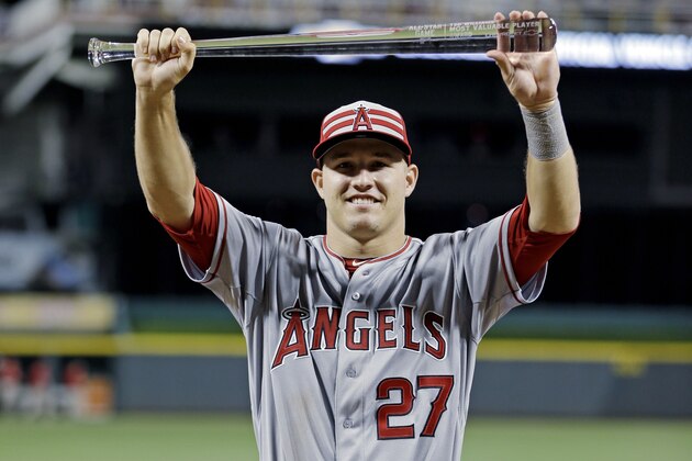 American League's Mike Trout, of the Los Angeles Angels, holds the MVP trophy after the MLB All-Star baseball game, Tuesday, July 14, 2015, in Cincinnati. The American League won 6-3. (AP Photo/Jeff Roberson)