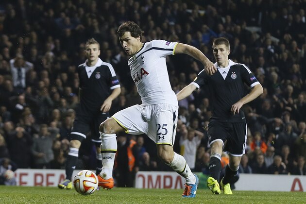 Tottenham's Benjamin Stambouli scores the opening goal during the Europa League group C soccer match between Tottenham Hotspur and Partizan Belgrade at White Hart Lane stadium in London, Thursday, Nov. 27, 2014 .(AP Photo/Alastair Grant)