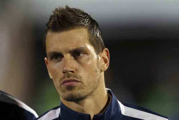 France's Morgan Schneiderlin stands during the playing of his country's national anthem before the start of their international friendly soccer match against Serbia, in Belgrade, Serbia, Sunday, Sept. 7, 2014. (AP Photo/Darko Vojinovic)