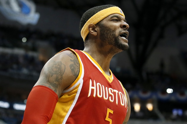 Houston Rockets' Josh Smith (5) celebrates after blocking a shot-attempt by Dallas Mavericks' Tyson Chandler in the second half of Game 3 in an NBA basketball first-round playoff series Friday, April 24, 2015, in Dallas. The Rockets won 130-128. (AP Photo/Tony Gutierrez)