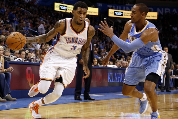 Oklahoma City's Perry Jones (3) drives the ball past Denver's Arron Afflalo (10) in the second half of an NBA basketball game in Oklahoma City, Saturday, Nov. 1, 2014. (AP Photo/Garett Fisbeck)