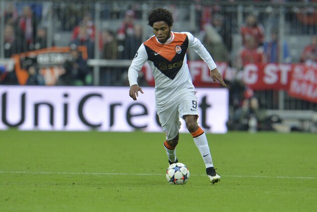 Shakhtar's Luiz Adriano goes with the ball during the Champions League round of 16 second leg soccer match between Bayern Munich and Shakhtar Donetsk Wednesday, March 11, 2015 in Munich, southern Germany. (AP Photo/Kerstin Joensson)