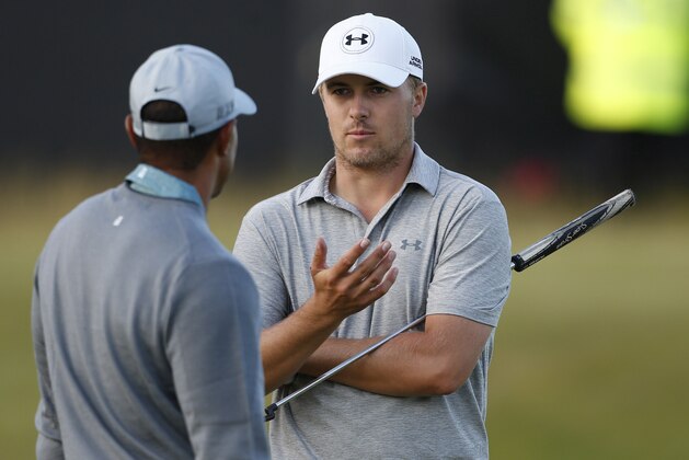 Jul 13, 2015; St. Andrews, Scotland, GBR; Jordan Spieth talks to Tiger Woods on the 16th green during a practice round for the 144th Open Championship at Royal and Ancient Golf Club of St Andrews. Mandatory Credit: Brian Spurlock-USA TODAY Sports