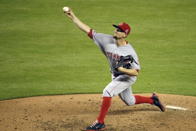 Cincinnati Reds starting pitcher Mike Leake throws in the fourth inning of a baseball game against the Miami Marlins, Friday, July 10, 2015, in Miami. (AP Photo/Lynne Sladky)
