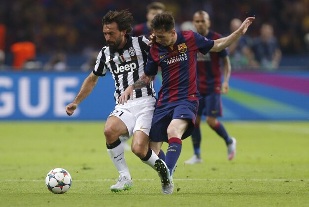 Juventus' Andrea Pirlo, left, is challenged by Barcelona's Lionel Messi during the Champions League final soccer match between Juventus Turin and FC Barcelona at the Olympic stadium in Berlin Saturday, June 6, 2015. (AP Photo/Frank Augstein) Juventus' Andrea Pirlo, left, is challenged by Barcelona's Lionel Messi during the Champions League final soccer match between Juventus Turin and FC Barcelona at the Olympic stadium in Berlin Saturday, June 6, 2015. (AP Photo/Frank Augstein)