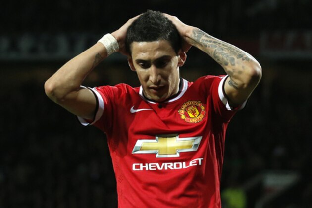 Manchester United’s Angel Di Maria holds his hands to his head after missing a chance to score a goal during the English FA Cup quarterfinal soccer match between Manchester United and Arsenal at Old Trafford Stadium, Manchester, England, Monday March 9, 2015. (AP Photo/Jon Super)