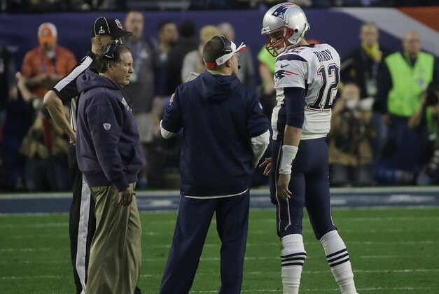 New England Patriots quarterback Tom Brady (12) talks with head coach Bill Belichick, left, and offensive coordinator Josh McDaniels during the first half of NFL Super Bowl XLIX football game against the Seattle Seahawks on Sunday, Feb. 1, 2015, in Glendale, Ariz. (AP Photo/Elise Amendola) New England Patriots quarterback Tom Brady (12) talks with head coach Bill Belichick, left, and offensive coordinator Josh McDaniels during the first half of NFL Super Bowl XLIX football game against the Seattle Seahawks on Sunday, Feb. 1, 2015, in Glendale, Ariz. (AP Photo/Elise Amendola)