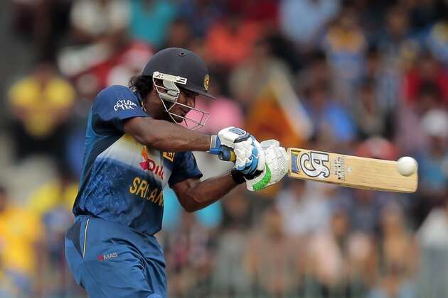 Sri Lankan batsman Kusal Janith Perera plays a shot during their fourth one-day international cricket match against England in Colombo, Sri Lanka, Sunday, Dec. 7, 2014. (AP Photo/Eranga Jayawardena)