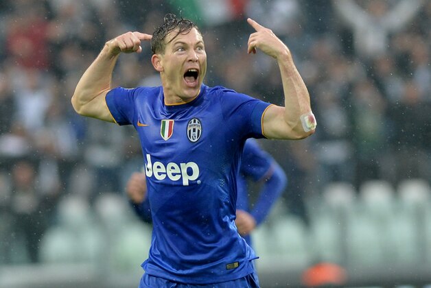 CORRECTS DATE - Juventus defender Stephan Lichtsteiner celebrates after scoring during a Serie A soccer match between Juventus and  Parma at the Juventus stadium, in Turin, Italy, Sunday, Nov. 9, 2014. (AP Photo/ Massimo Pinca)