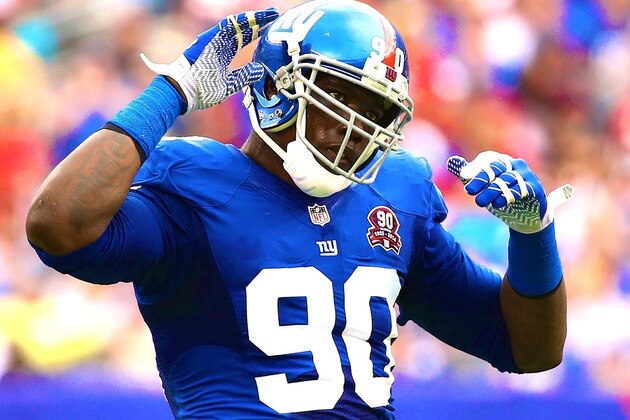 New York Giants defensive end Jason Pierre-Paul (90) walks the field during the first half of an NFL football game, Sunday, Oct.  19, 2014, in Arlington, Texas. (AP Photo/LM Otero)