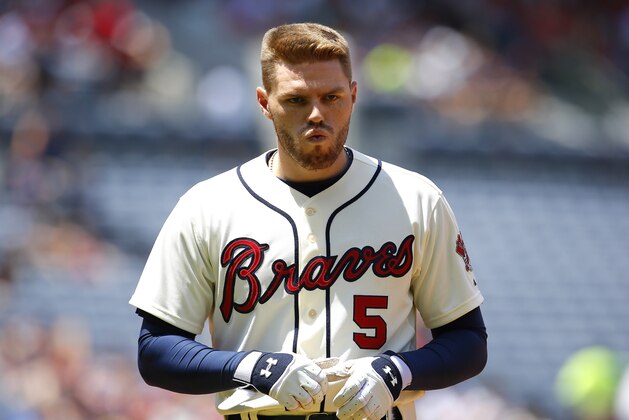 Atlanta Braves' Freddie Freeman (5) reacts after flying out to end the second inning of a baseball game against the Cincinnati Reds, Sunday, May 3, 2015, in Atlanta. The Braves won the game 5-0. (AP Photo/Todd Kirkland)