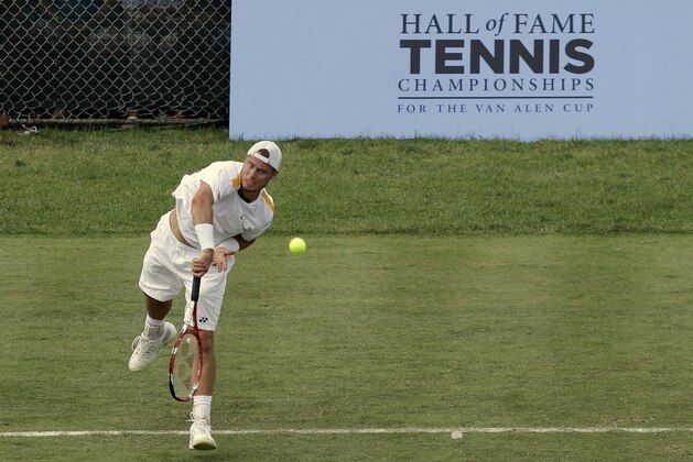 Lleyton Hewitt, of Australia, serves to opponent Jan Hernych, of Czech Republic, during a quarterfinal match at the Hall of Fame Tennis Championships in Newport, R.I., Friday, July 12, 2013. Hewitt won 6-7 (3), 6-4, 6-2. (AP Photo/Elise Amendola)