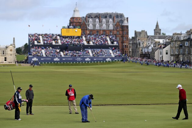 Scotland’s Sandy Lyle, in blue at center, putts on the hole one during a special Champion Golfers' challenge at the British Open Golf Championship at the Old Course, St. Andrews, Scotland, Wednesday, July 15, 2015. (AP Photo/Peter Morrison)