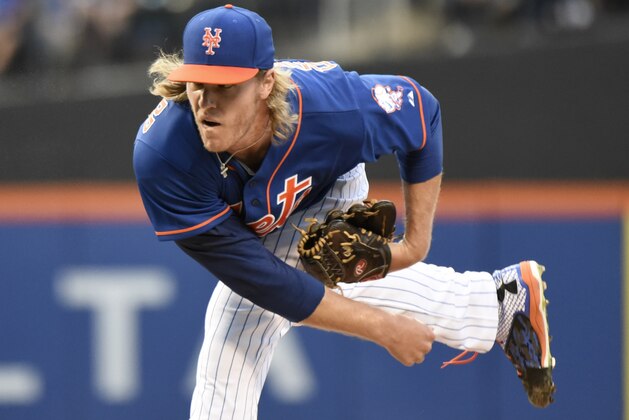 New York Mets pitcher Noah Syndergaard delivers the ball to the Arizona Diamondbacks during the first inning of a baseball game Friday, July 10, 2015, at Citi Field in New York. (AP Photo/Bill Kostroun)