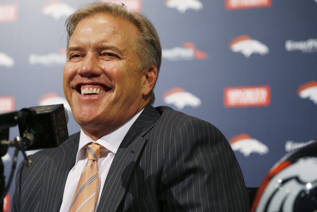 Denver Broncos general manager John Elway jokes with reporters after he talks about the team's selection in the NFL Draft Thursday, April 30, 2015, in Englewood, Colo. The Broncos traded up from the 28th to the 23rd pick to select Missouri pass rusher Shane Ray. (AP Photo/David Zalubowski)