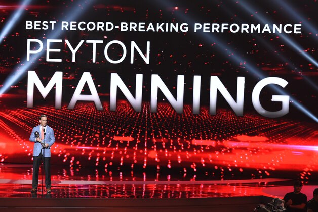 NFL player Peyton Manning, of the Denver Broncos, accepts the award for best record-breaking performance at the ESPY Awards at the Microsoft Theater on Wednesday, July 15, 2015, in Los Angeles. (Photo by Chris Pizzello/Invision/AP)