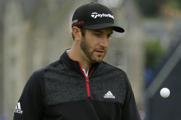 United States’ Dustin Johnson balances a ball on hole two during a practice round at the British Open Golf Championship at the Old Course, St. Andrews, Scotland, Tuesday, July 14, 2015. (AP Photo/David J. Phillip)