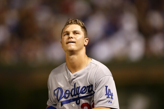 Los Angeles Dodgers' Joc Pederson looks into the stands after hitting into a double play off a pitch from Chicago Cubs relief pitcher James Russell, to end the top half of the sixth inning of a baseball game Monday, June 22, 2015, in Chicago. (AP Photo/Charles Rex Arbogast)