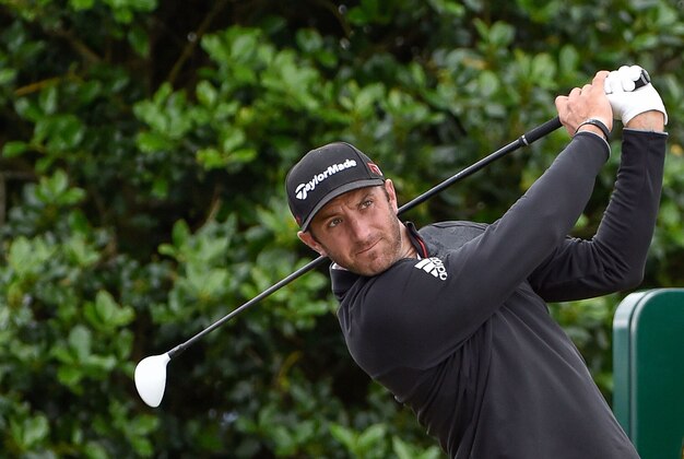 Jul 14, 2015; St Andrews, GBR;  Dustin Johnson plays his tee shot on the 3rd hole during Tuesday practice for the The 144rd Open Championship at The Royal & Ancient Golf Club of St Andrews. Mandatory Credit: Steve Flynn-USA TODAY Sports
