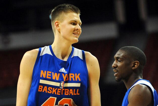 Jul 11, 2015; Las Vegas, NV, USA; New York Knicks forward Kristaps Porzingis (46) is consoled by a teammate after being assessed a foul during an NBA Summer League game against San Antonio at Thomas & Mack Center. Mandatory Credit: Stephen R. Sylvanie-USA TODAY Sports
