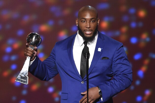 NFL player Devon Still, of the Cincinnati Bengals, accepts the Jimmy V award for perseverance at the ESPY Awards at the Microsoft Theater on Wednesday, July 15, 2015, in Los Angeles. (Photo by Chris Pizzello/Invision/AP)