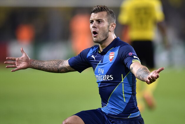 Arsenal's Jack Wilshere gestures during the Champions League group D soccer match between Borussia Dortmund and Arsenal in Dortmund, Germany, Tuesday, Sept.16,2014. (AP Photo/Martin Meissner)