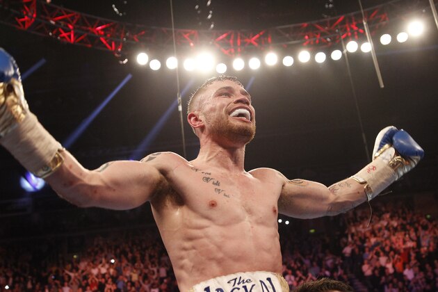 World champion Carl Frampton celebrates with after defeating Chris Avalos of the U.S. during the IBF super bantamweight world boxing title fight at the Odyssey arena, Belfast, Northern Ireland, Saturday, Feb. 28, 2015. (AP Photo/Peter Morrison)